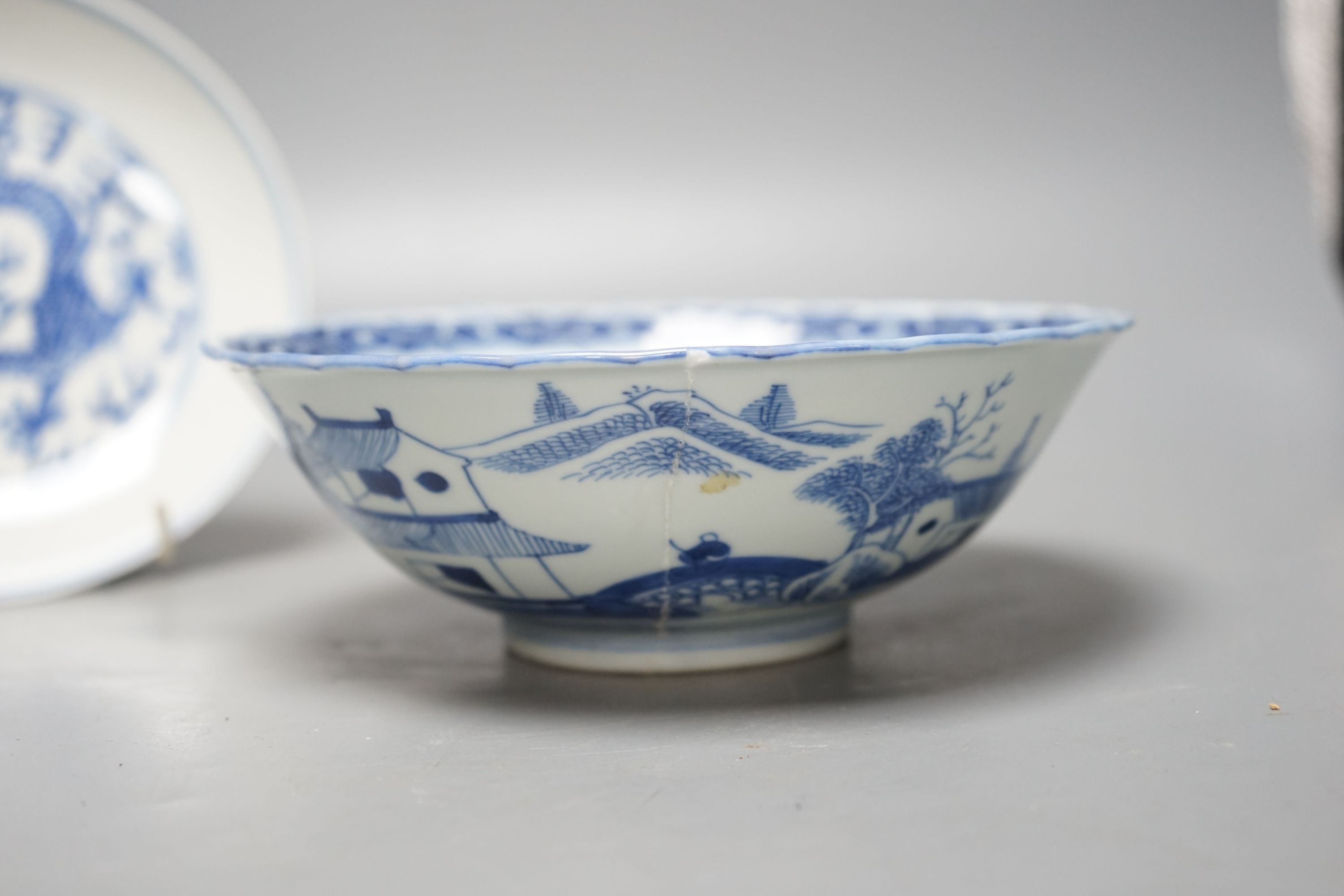 A Chinese blue and white landscape bowl, a/f and a Chinese blue and white 'dragon' dish, 18cm and 16.5cm